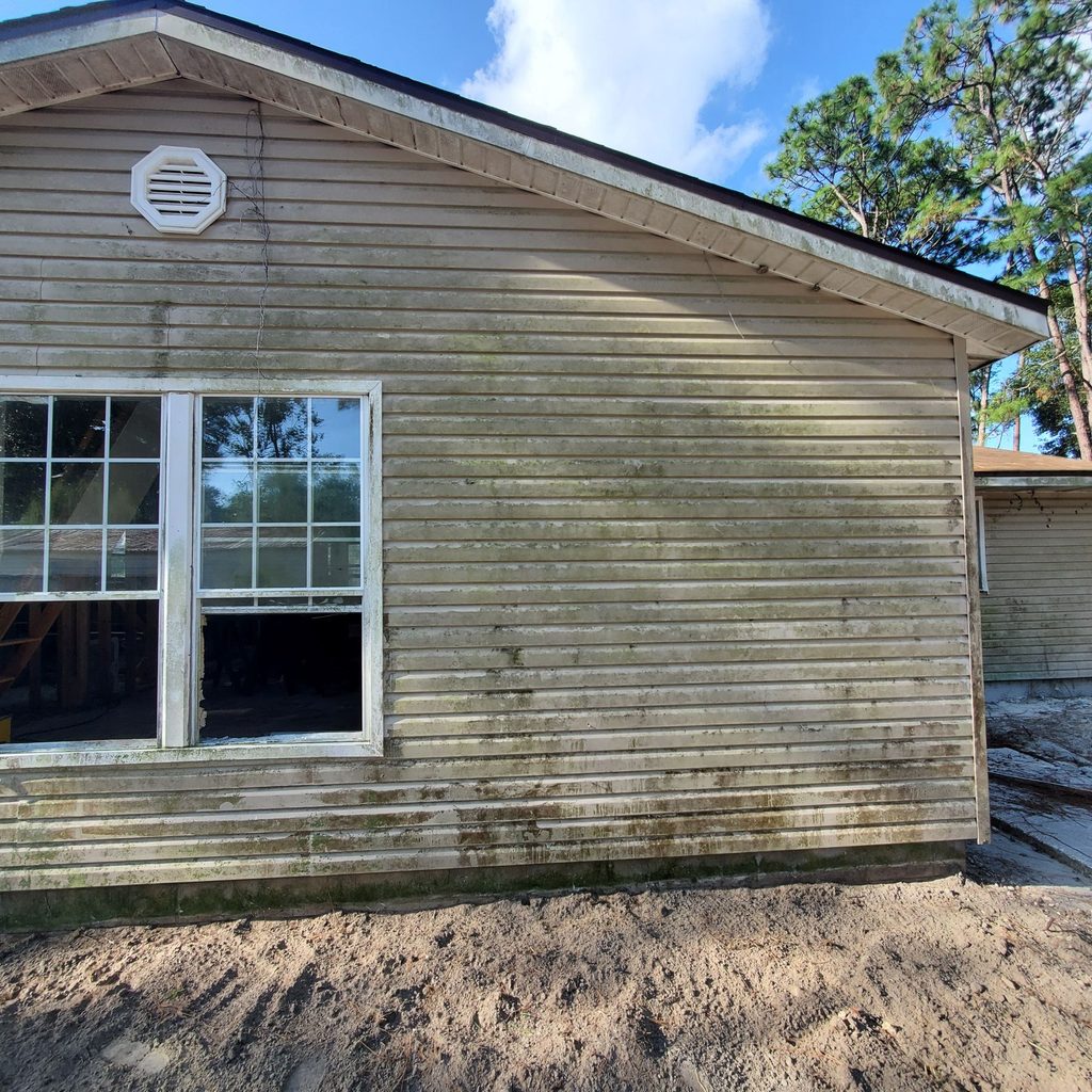 House siding before soft washing in Jacksonville, FL
